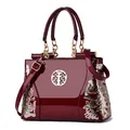 Burgundy patent leather tote bag with gold floral embroidery and metallic buckle - Burgundy
