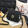 Elegant black lychee textured leather handbag with gold ring clasp and shoulder strap - Round Lock Style / Black