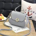 Gray lychee grain PU leather small handbag with pale gold hardware and crossbody strap - Round Lock Style / Gray