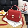 Red stylish PU leather handbag with gold buckle and adjustable long shoulder strap - Round Lock Style / Red