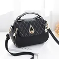 Black PU leather crossbody bag with litchi texture and gold twist-lock closure - Water Drop Style / Black