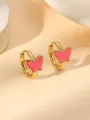 Close-up of luxury gold butterfly drop earrings with pink enamel and beaded edge - Pink