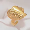 Detailed view of 18k gold plated stainless steel ring with hammered and smooth texture - Round Heart Style