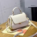 Chic beige lychee grain faux leather handbag with gold metal trim and crossbody strap - Heart Style / Gray