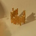 Macro detail of 18k gold plated open ring with modern molten irregular texture - Irregular Wavy Style