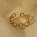 Detail of 18k gold plated open ring featuring beaded edge texture and hollow circular design - Round Hollow Style