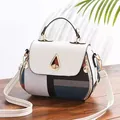 Fashionable geometric patchwork PU leather handbag in white and blue with gold twist lock - Grid Style / Off-white
