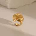Macro detail of golden croissant textured ring with a ribbed dome and open adjustable band - Ribbed Ruched Design (W682 Style 2)