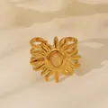Detail of 18k gold sunburst ring with oval gemstone and intricate layered band - Pink Crystal Sunburst Style