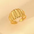 Macro detail of 18k gold plated croissant ring with elegant vertical textured design - Pleated Texture Wide Style