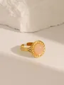 Detail of 18K gold-plated ring with a pink round gemstone and adjustable twist band - Style 4 Rose Quartz (W686)