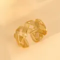 Detailed close-up of 18k gold plated stainless steel ring with woven texture - Woven Cross Texture Style