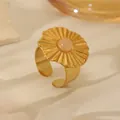 Detail of 18k gold plated ring featuring a sunburst textured disc and pink gemstone inlay - Radiant Disc Pink Crystal Style