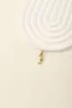 Detail of gold letter J pendant with inlaid white and blue cubic zirconia crystals - Letter J