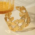 Detailed view of a gold-plated butterfly cuff bracelet with intricate hollow wing details - Hollow Butterfly Style (W1830-2)
