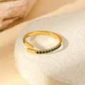 Macro shot of gold plated open ring with green zircon stones on white rock base - Green Zirconia Row Setting Open Ring (W1492-1)