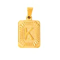 Macro detail of gold-plated rectangular pendant with embossed letter K and sunburst texture - Letter K