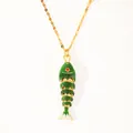 Close-up of 18k gold plated koi fish necklace with green enamel and flexible joints - Green Glazed Fish