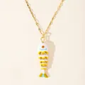 Macro detail of 18k gold plated koi fish pendant with vibrant enamel and orange crystal eye - White and Orange Fish (5-DQ-W-Fish)