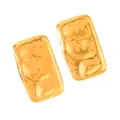 Macro detail of 18k gold plated earrings featuring a modern hammered metal texture - Hammered Rectangle Style (12-DQ-W-111)