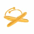 Macro view of adjustable gold plated ring with a minimalist crisscross design - Crossed Ball Design / Gold