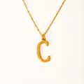 Detail of 18k gold plated letter C pendant with hammered texture and fine chain - Letter C