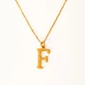 Detailed close-up of golden letter F necklace with unique textured metallic surface - Letter F