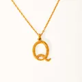 Detail of 18k gold plated letter Q pendant with hammered texture on a slim chain necklace - Letter Q
