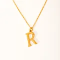 Macro detail of 18k gold plated letter R pendant featuring a unique bark texture design - Letter R