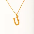 Detail of 18k gold plated letter U pendant featuring a unique bark texture finish - Letter U