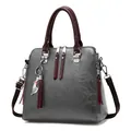 Dark grey PU leather handbag with burgundy handles and a silver cat charm pendant - Gray