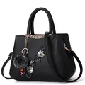 Large capacity black floral embroidered handbag for women with adjustable strap and charm - Steel Bar Style / Black