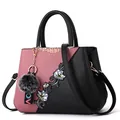 Pink and black patchwork handbag with floral embroidery, fur pompom, and detachable strap - Steel Bar Style / Pink