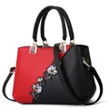 Red and black paneled tote with floral embroidery and lychee texture finish - Classic / Burgundy
