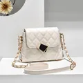 Elegant white quilted chain crossbody bag with black and gold geometric metal clasp buckle - White