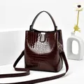 Dark brown faux crocodile leather bucket bag with shiny finish and detachable strap - Red Brown