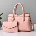 Pink two-piece tote bag and wallet set with embossed crocodile texture and gold hardware - Pink