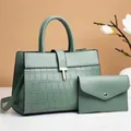 Detail of mint green tote with crocodile pattern and matching envelope coin purse - Green