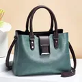 Vintage green and brown paneled leather handbag with large square buckle and shoulder strap - Green