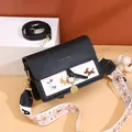 Fashionable crossbody bag in black leather and white canvas with cute dog embroidery - Black