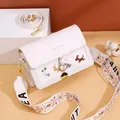 White square crossbody bag featuring cute cartoon dog embroidery and two interchangeable straps - Off White