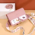 Elegant pink and white crossbody bag featuring dog embroidery and dual shoulder straps - Pink