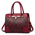 Red snakeskin pattern tote bag with golden hardware and detachable shoulder strap - Red