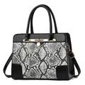 Women's black faux leather tote with snakeskin pattern panel and gold hardware - Black