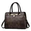 Brown faux snakeskin tote bag with top handles and gold hardware in textured dark coffee - Coffee