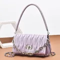 Lavender pleated shoulder bag with sparkling rhinestone chain and woven top handle - Purple