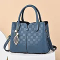 Blue faux leather handbag with plaid pattern and elegant pearl leaf pendant - Blue