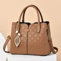 Brown faux leather handbag with litchi texture and elegant leaf pearl pendant detail - Brown