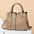 Elegant khaki checkered handbag for women featuring a golden leaf and pearl charm detail - Khaki