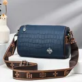 Navy blue crocodile pattern Boston bag with silver clover logo and wide strap - Sapphire Blue